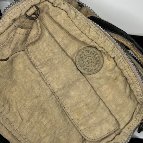 Kipling beige crossbody bag used with multiple compartments and strap