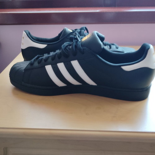 Adidas Superstar sneakers size 52.5, black and gold