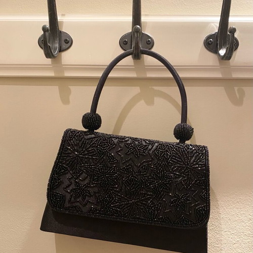 Mini black handbag like new with beaded embossed design