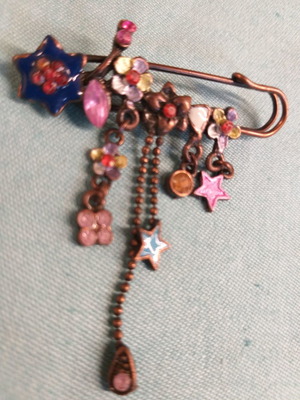 Bronze safety pin brooch with variety of flowers