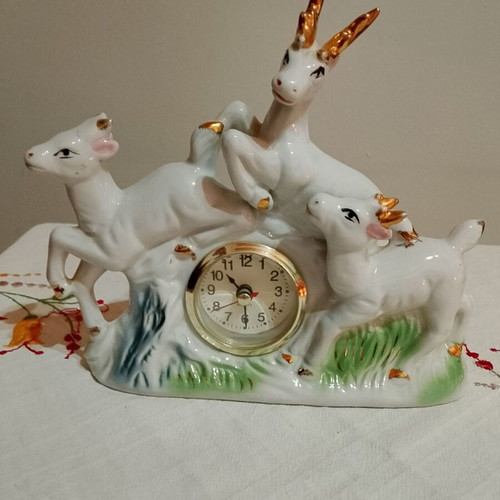 Vintage decorative tabletop figurine with clock used