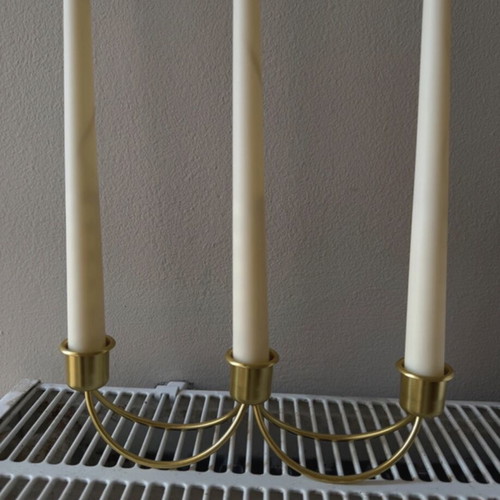 Gold candlestick holder without candles