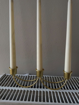 Gold candlestick holder without candles