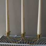 Gold candlestick holder without candles