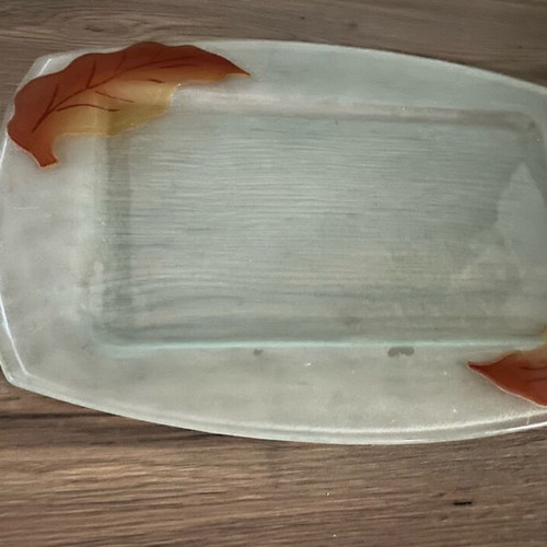 Decorative glass tray used with embossed leaf design