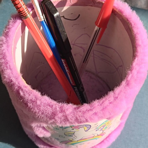 Fluffy pink pencil holder with unicorn design