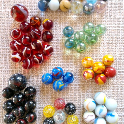 Set of 68 glass marbles used with collectible designs and 2 large shooters