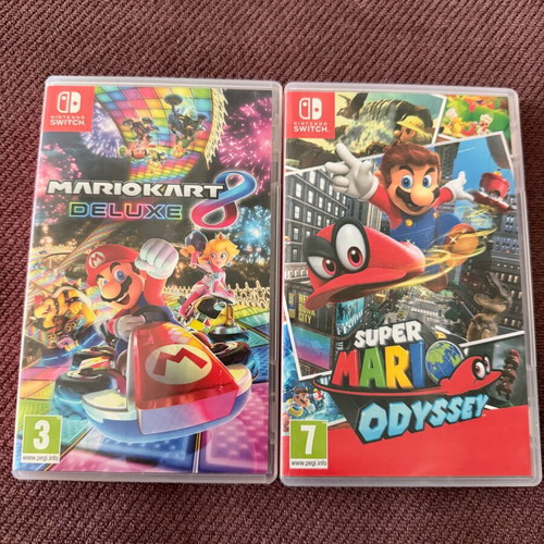 Nintendo Switch OLED like new with accessories and two games