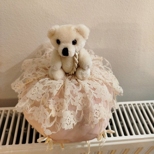 Stuffed bear on ball like new