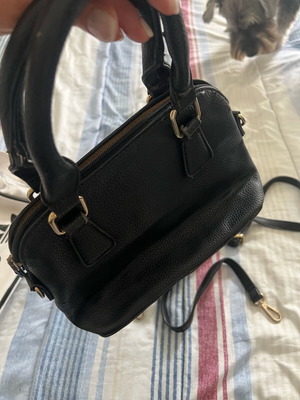 Small handbag used with additional strap, black