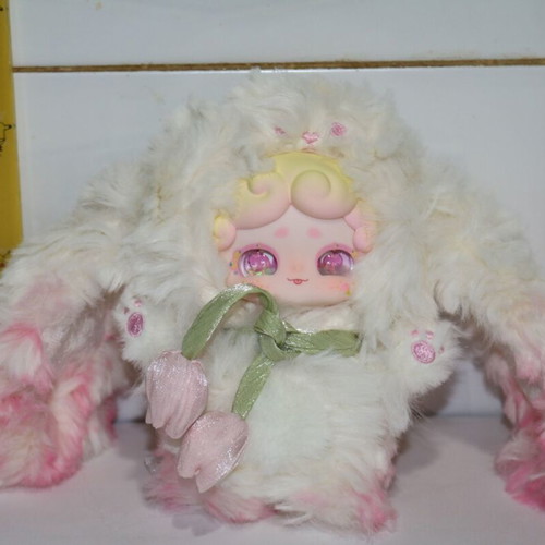 Plush doll baby miniature with flower