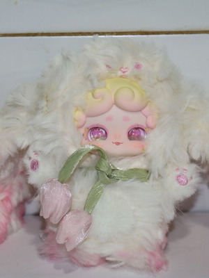 Plush doll baby miniature with flower