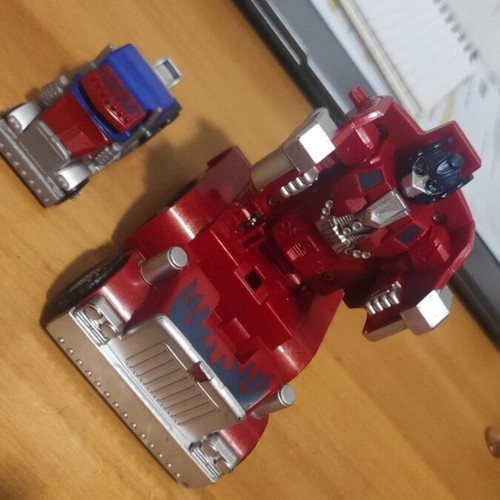 Transformers Optimus Prime figures used, both together
