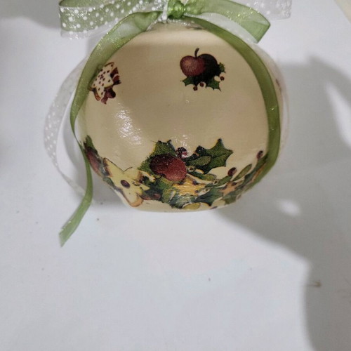 Christmas pomegranate new decorated with ribbons and decoupage