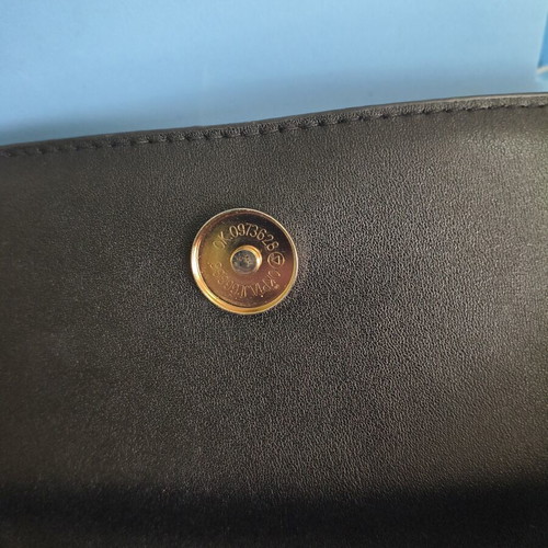 Shoulder bag with adjustable strap, black and red