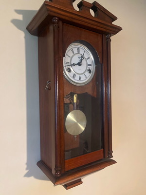 Wooden wall clock like new with pendulum and Roman numerals