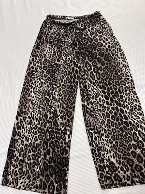 Leopard print palazzo pants with elastic waist and drawstring