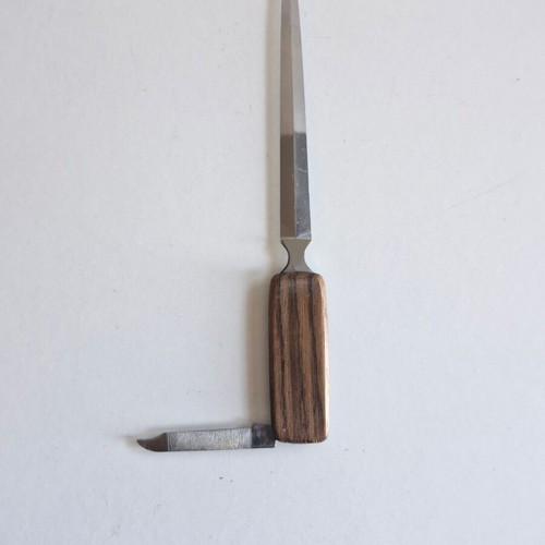 Paper cutter with built-in knife used