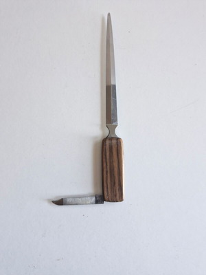 Paper cutter with built-in knife used