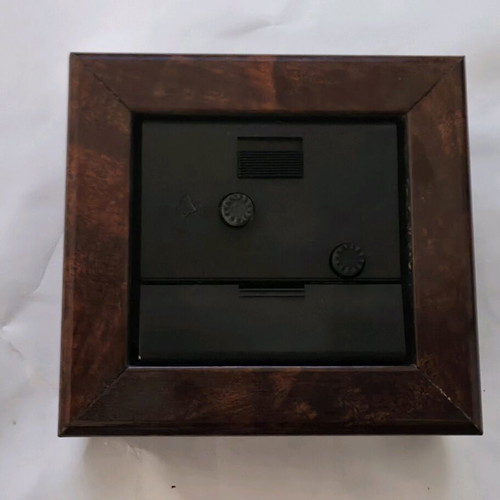 Silver table clock used with wooden frame