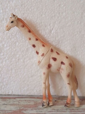 Vinyl giraffe animal figure used
