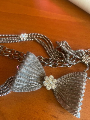 Metal belt like new, silver with bow and rhinestones