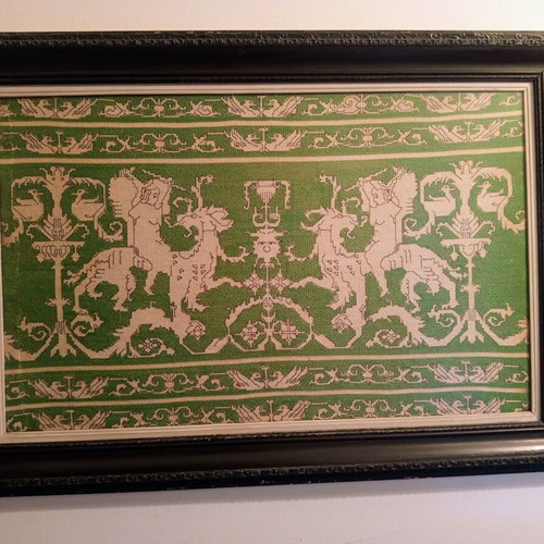 Handmade embroidery in large black Corinthian-style frame, used