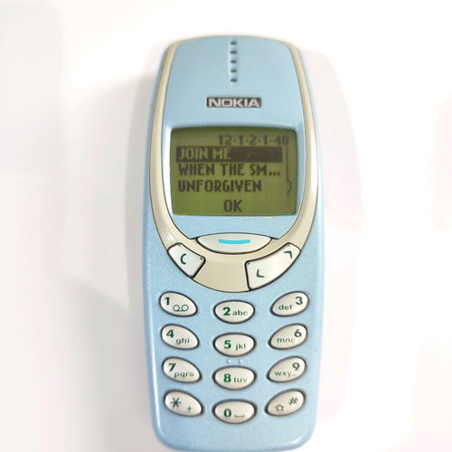 Nokia 3330 phone used with charger and buttons