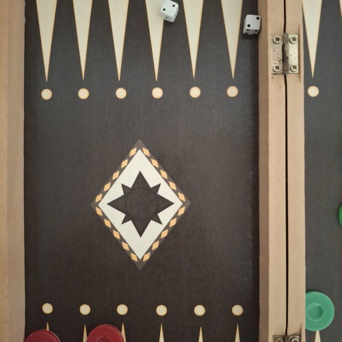 Backgammon and chess board used, missing chess pieces