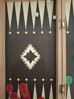 Backgammon and chess board used, missing chess pieces