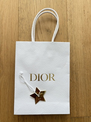 Dior paper bag with gold charm