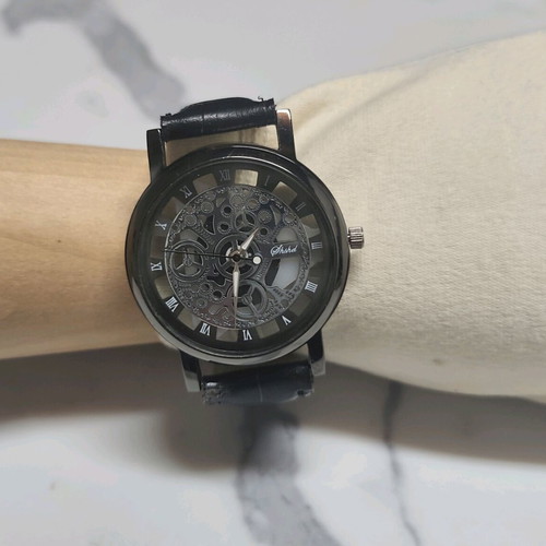 Skeleton watch like new with Roman numerals, black dial and strap