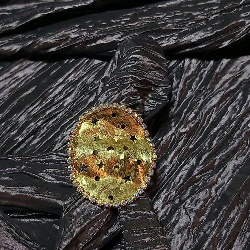Large ring used, gold color with small strass