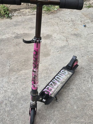 Scooter with stopper used, folds for easy storage