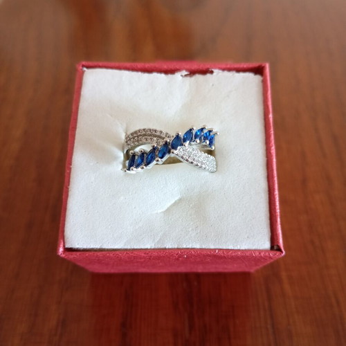 Ring new, gold plated with blue and silver zircon stones, size 7