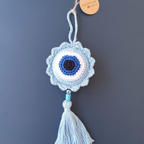 Handmade baby blue crocheted eye decoration