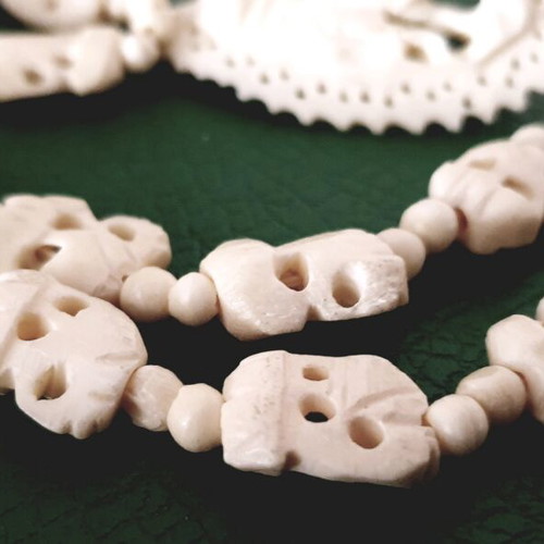 Carved vintage bone necklace with elephant pendant