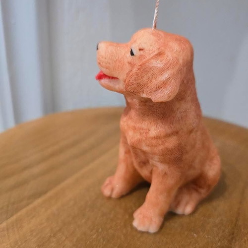 Handmade dog-shaped candle