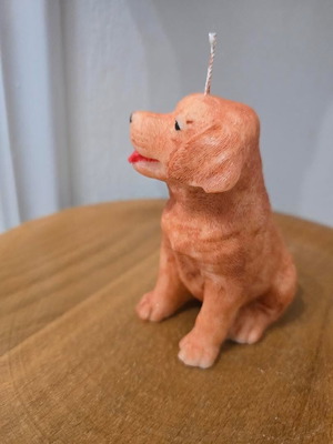 Handmade dog-shaped candle