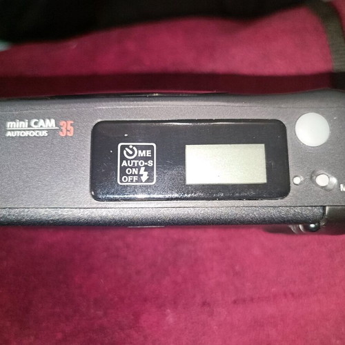 Mini Cam 35mm camera used with built-in flash