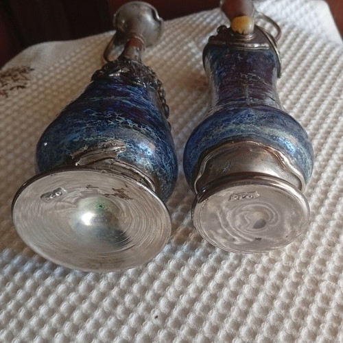 Vintage decorative silver pitchers with blue blown art glass