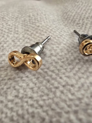Infinity stud earrings in gold tone