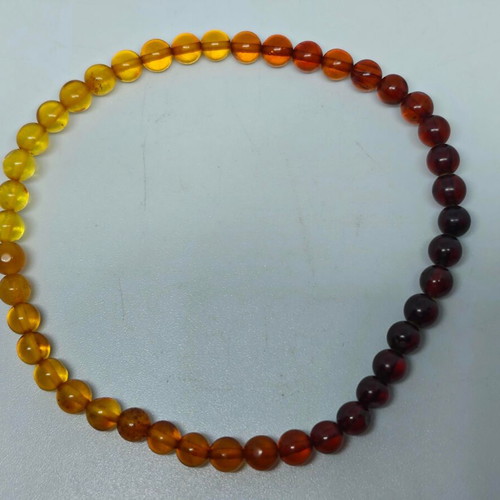 Handmade bracelet from natural amber with color gradient like new