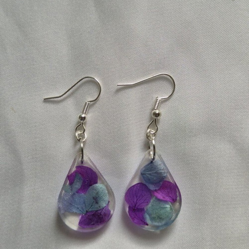 Liquid glass earrings new with purple and turquoise dried flowers