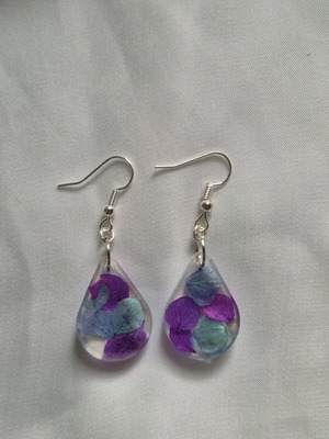 Liquid glass earrings new with purple and turquoise dried flowers