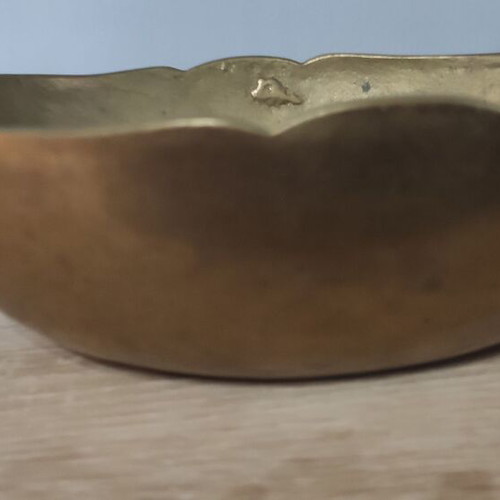 Vintage decorative brass bowl with two handles and wavy rim