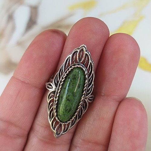 Women's ring new with green stone