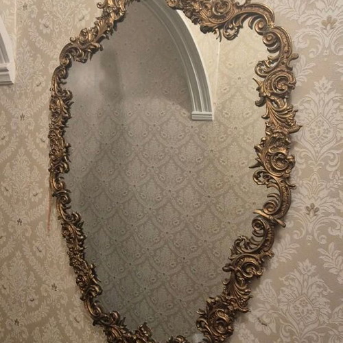 Rococo style wall mirror with gold embossed frame