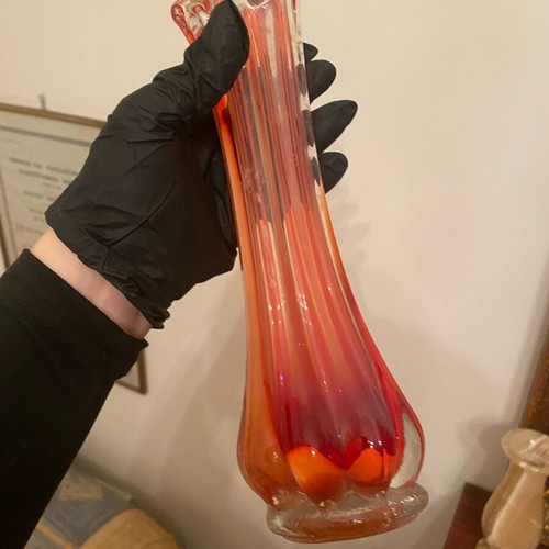 Glass vase used with thin neck in red color