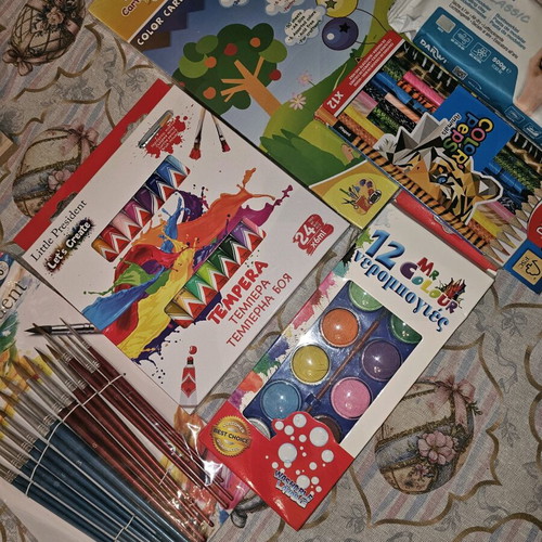 Art supplies like new with tempera, watercolors, plaster, brushes, and color papers